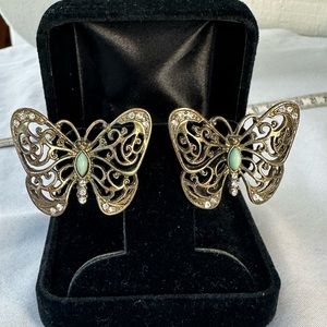 Open scrollwork butterfly and rhinestone earrings